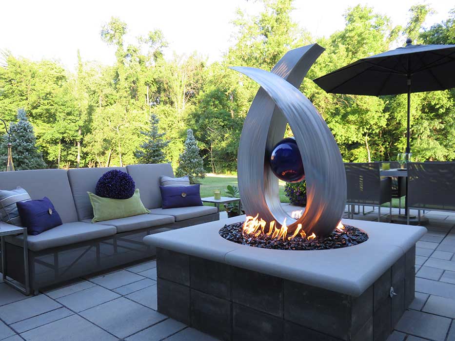Custom Fire Feature with Custom metal art in the center