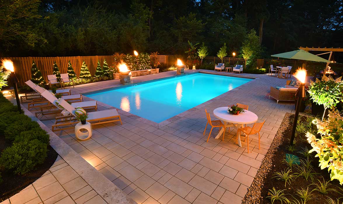 Copper Fire and Water Features and Tiki Torches around a Pool
