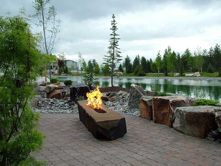 Fire boulder with a pond in the background