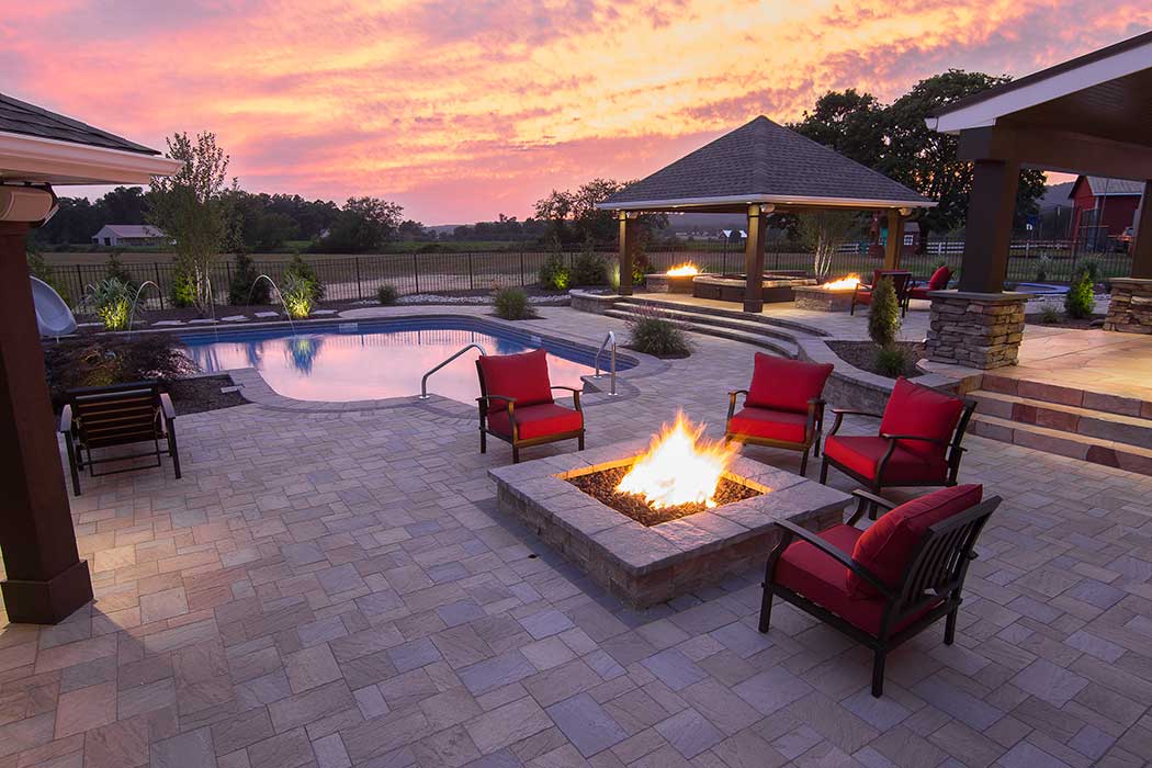 Fire Features with a Pool and Hot tub in the background